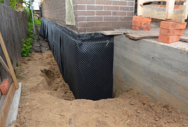 SJ Waterproofing Pros technician performing targeted Wet Basement Repair assessment in Grandview, TN